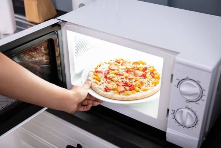 Can You Microwave Frozen Pizza? (And Some Helpful Tips) | Kitchens HQ